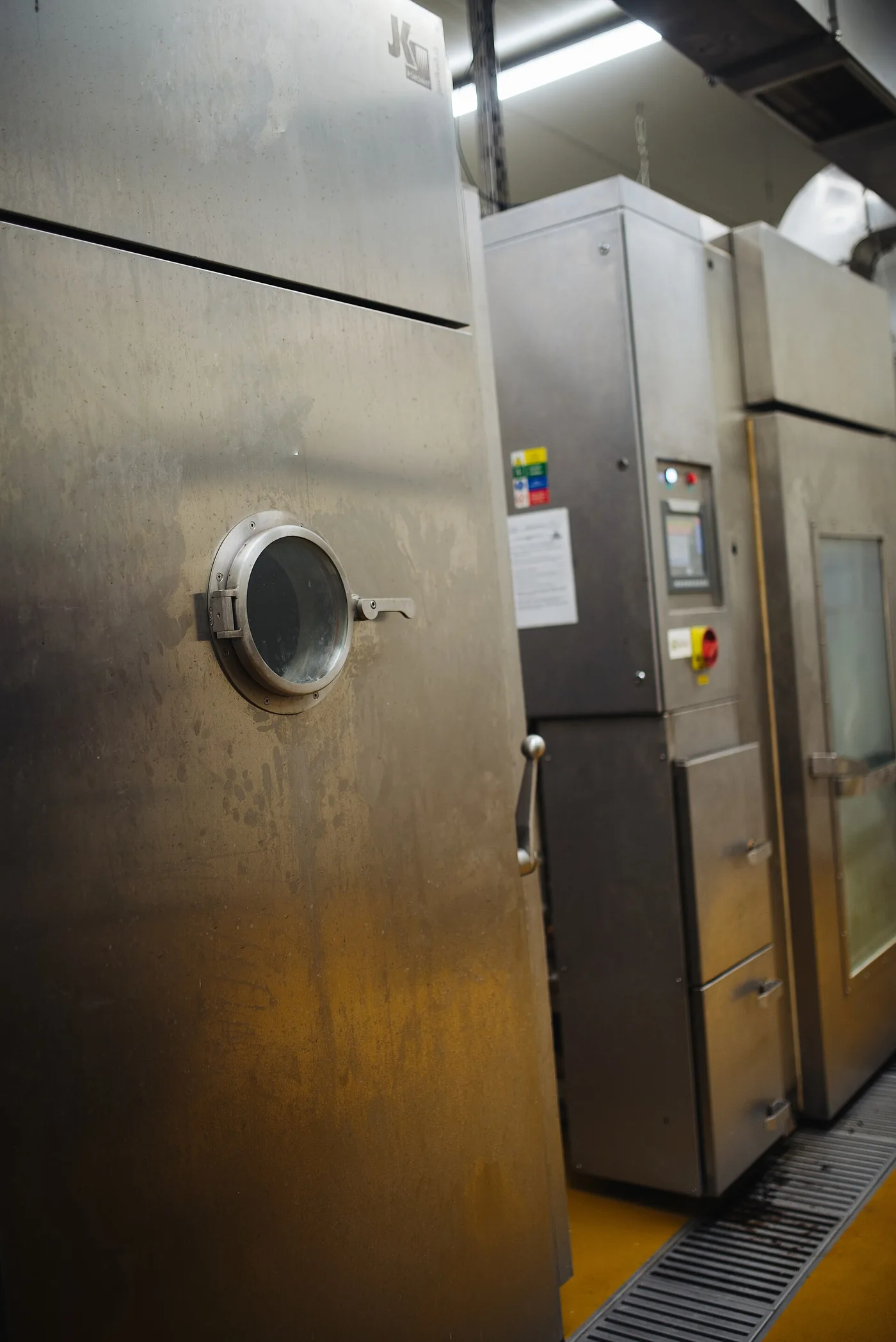 Stainless-steel cooking and storage equipment in a commercial restaurant kitchen.