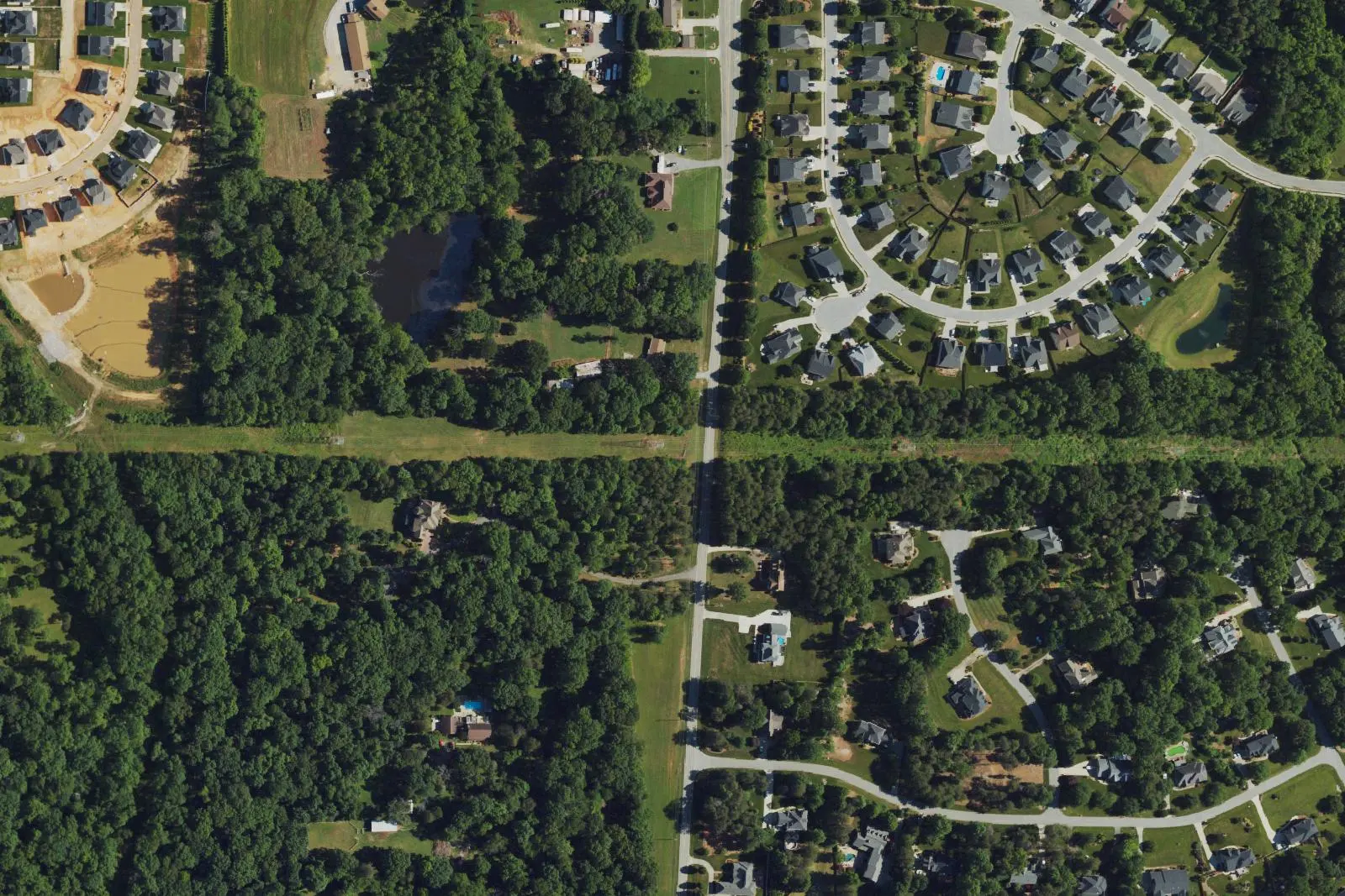 Subdivisions and woods in northwest High Point near the Southwest Guilford schools, seen from the air