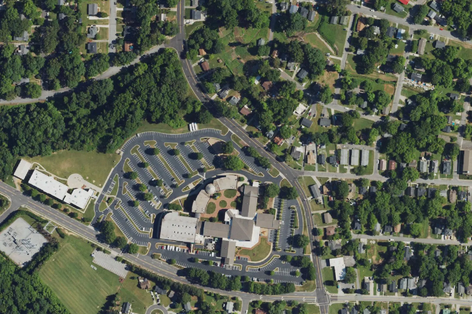 Streets, homes and school grounds in High Point's West End, west of downtown, seen from the air