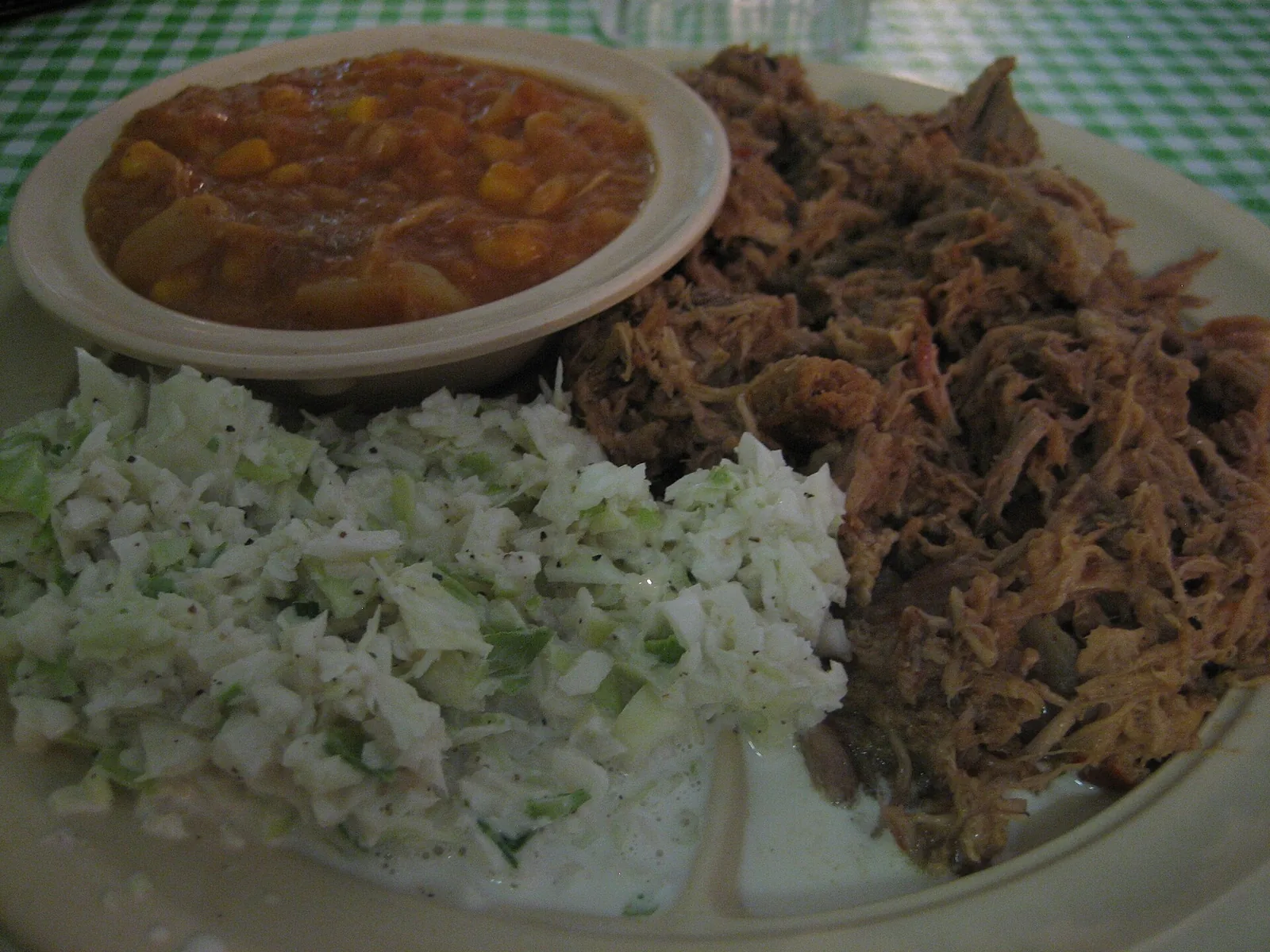 A plate of pulled pork barbecue with coleslaw and Brunswick stew. The photo was not taken in High Point.